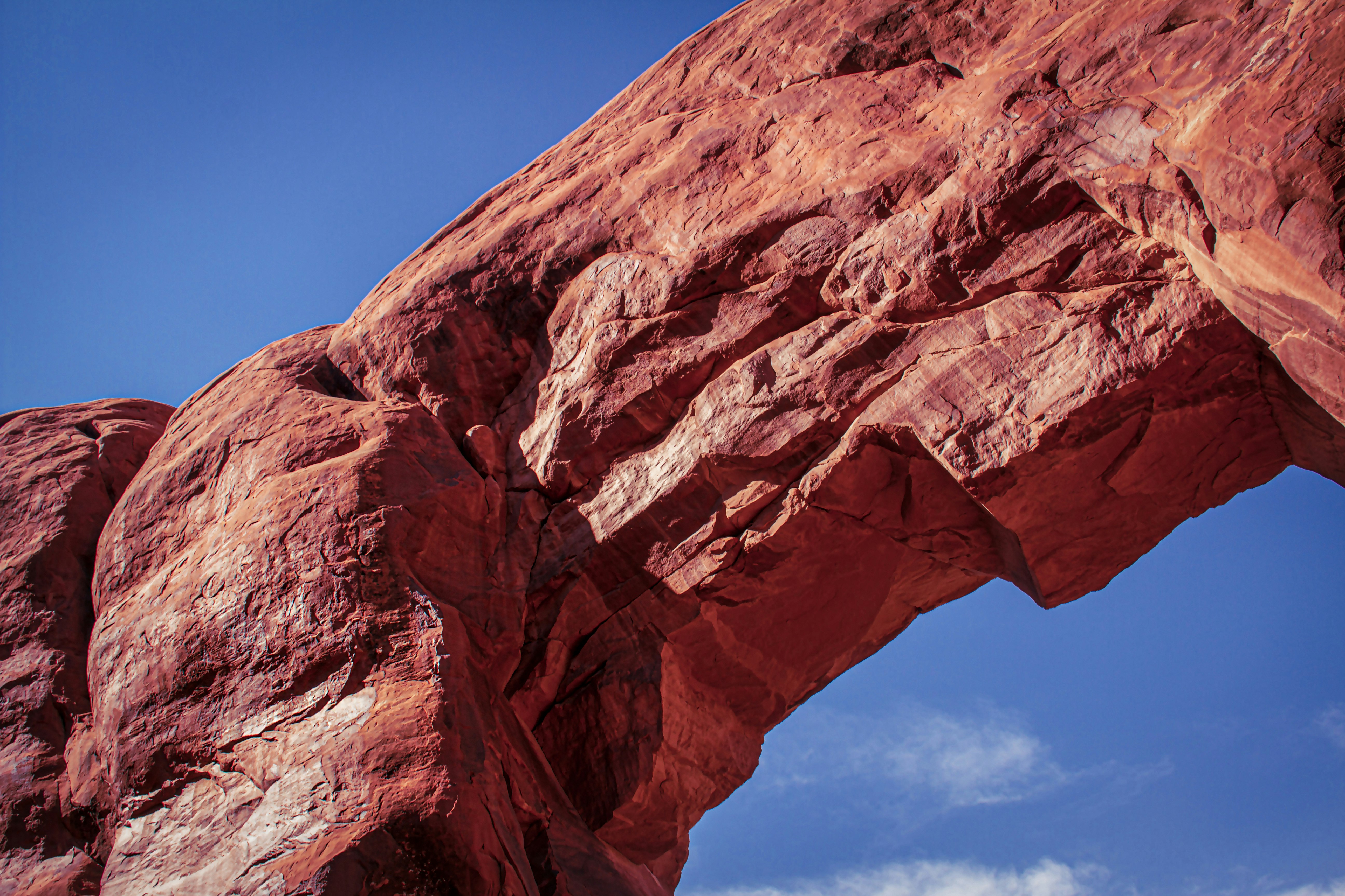 brown rock formation under blue sky during daytime